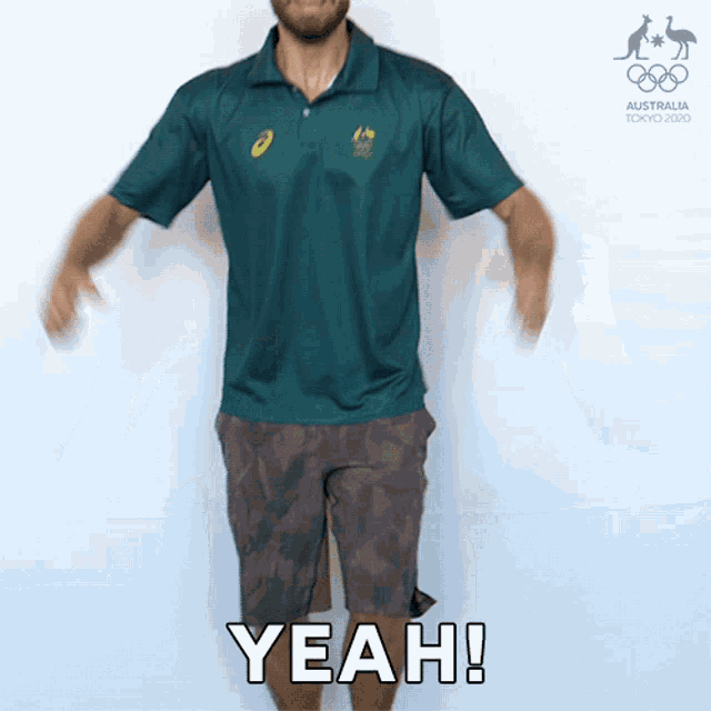 a man wearing a green polo shirt and shorts says yeah