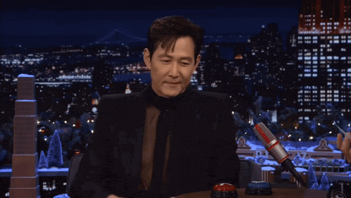 a person with a ring on their finger is touching a button