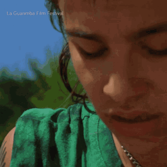 a close up of a person 's face with the words la guarimba film festival visible