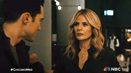 a man and a woman are looking at each other in a scene from chicago med