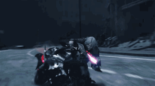 a man riding a motorcycle with a purple light on the front