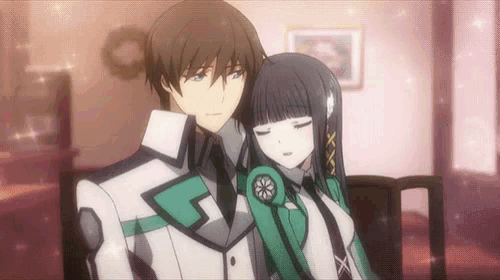 a man and a girl are hugging each other in a room .