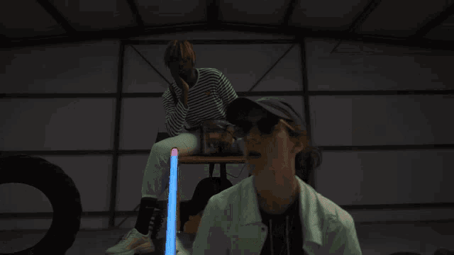 a blurry picture of people in a room with a ceiling