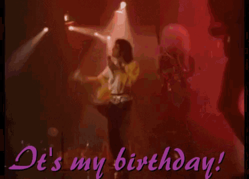 a man singing into a microphone with the words " it 's my birthday " written below him