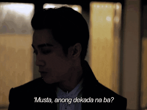 a man in a suit says " musta anong dekada na ba " in a foreign language