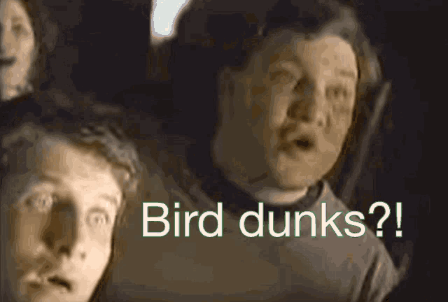 a group of boys are sitting in a dark room and the words bird dunks are displayed on the screen