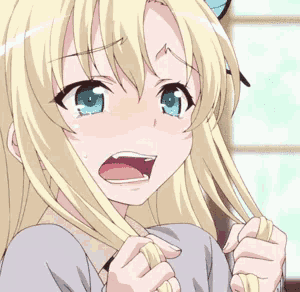 a girl with blonde hair and blue eyes is crying
