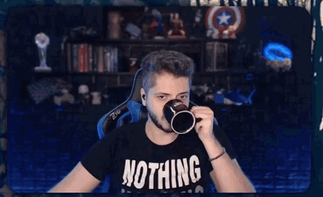 a man wearing a shirt that says nothing is making a funny face