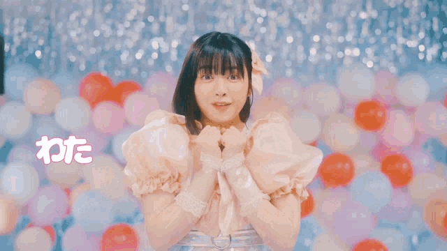 a girl in a pink dress is surrounded by pink and red balloons and the words written in a foreign language