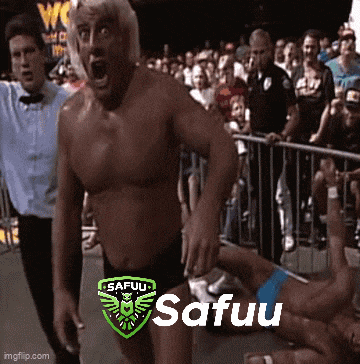 a shirtless wrestler is standing in front of a crowd with the word safuu on his chest