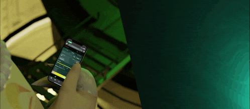 a person is holding a cell phone with a screen that says ' aol ' on it