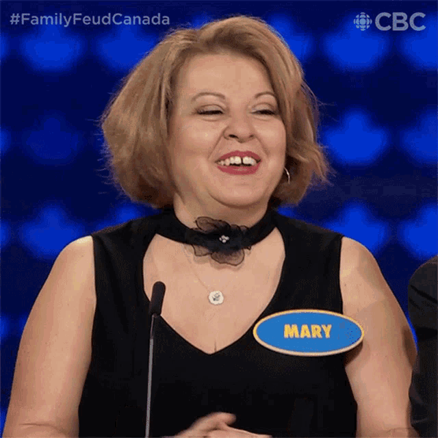 a woman wearing a name tag that says mary on it