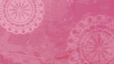 a close up of a flower on a pink background with a lace border .