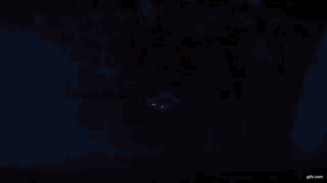 a dark background with a gifs.com watermark on the bottom