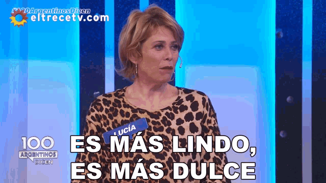 a woman in a leopard print shirt says " es mas lindo "