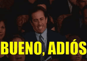 a man in a suit and tie is waving in front of a crowd with the words bueno adios written in yellow