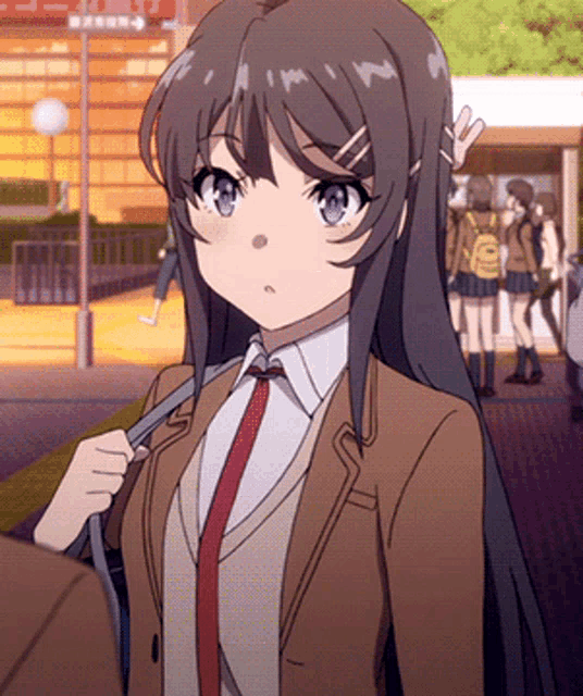 a girl in a brown jacket and red tie is standing in front of a sign that says exit 2