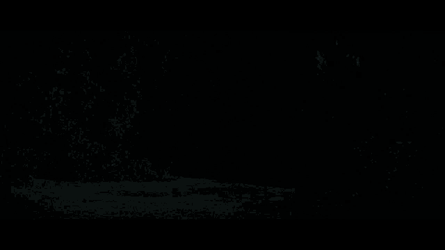 a close up of a car 's headlight in the dark
