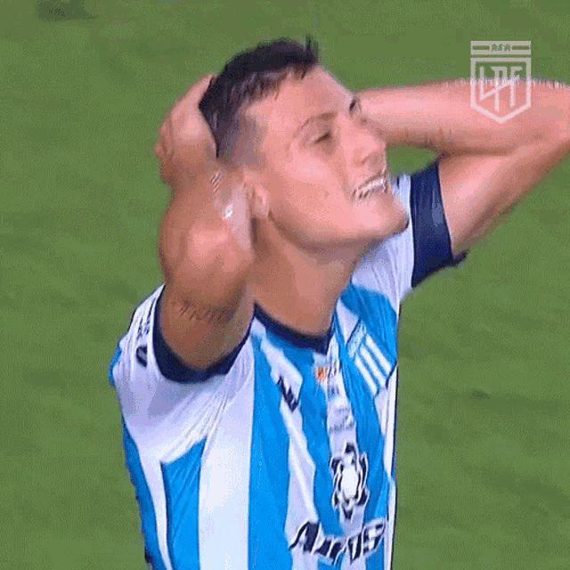 a man in a blue and white striped shirt with a lpf logo on the bottom