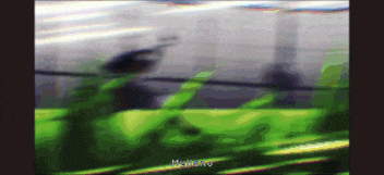 a blurry picture of a person standing in a field with the words " mynero " on the bottom right