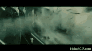 a movie scene with a lot of smoke coming out of a car window .