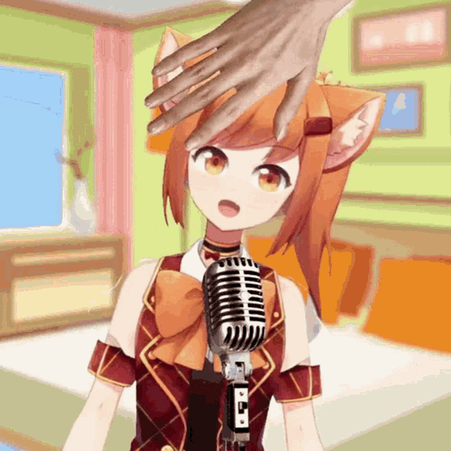 a hand is touching a girl 's head while holding a microphone