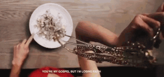 a woman is holding a plate of food with the words you 're my gospel