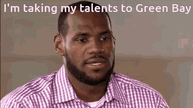 a man in a plaid shirt with the words i 'm taking my talents to green bay