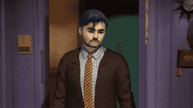 a man in a suit and tie stands in front of a door