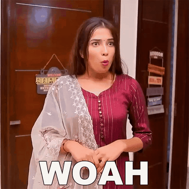 a woman is standing in front of a door with the word woah written on the bottom