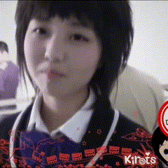 a girl in a school uniform is standing in front of a sign that says kirats