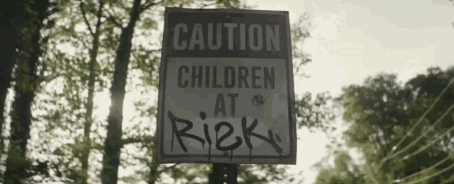 a sign that says caution children at risk