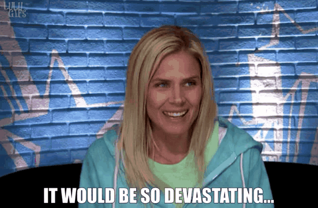 a woman says it would be so devastating in front of a blue wall