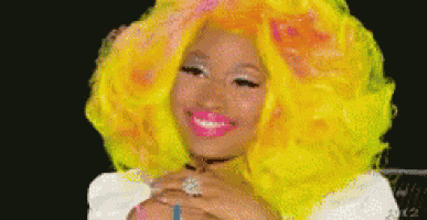 a woman with bright yellow hair is smiling and wearing a choker .