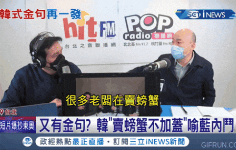 two men are sitting in front of a hit fm radio sign