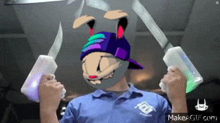 a man wearing a bunny mask is holding a pair of glow in the dark swords