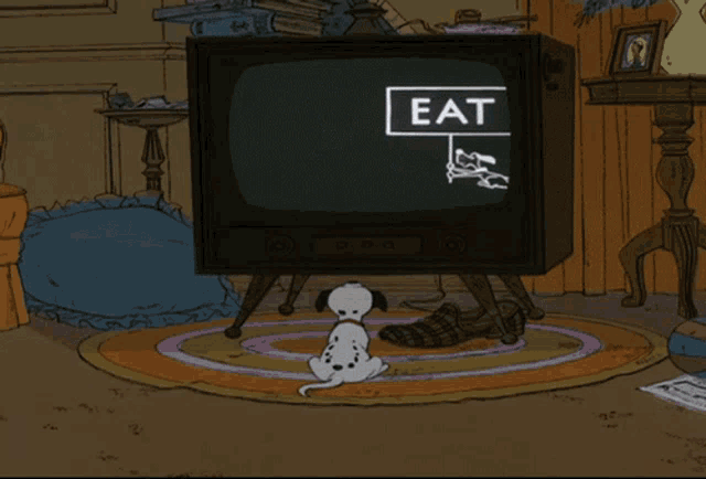 a dalmatian dog is sitting in front of a television that says eat