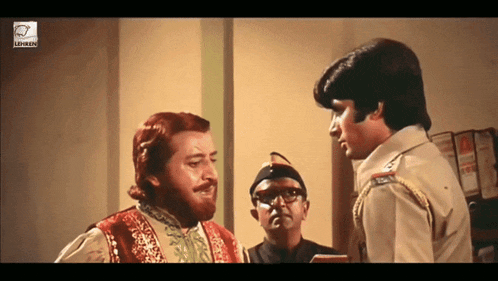 a man with a beard is talking to a police officer in a movie