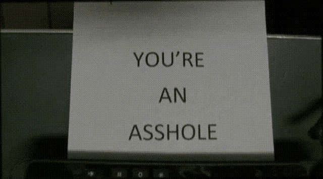 a piece of paper with the words you 're an asshole on it