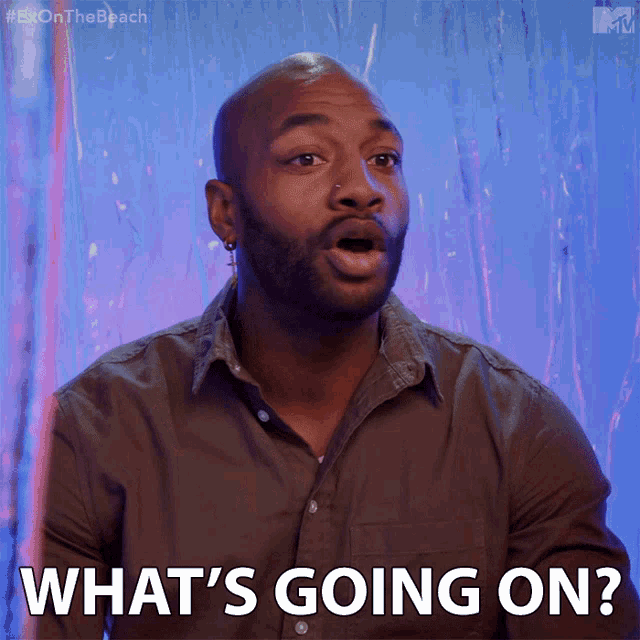 a man says what 's going on in front of a blue wall