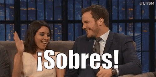 a man and a woman are sitting next to each other on a couch with the words sobres written on the screen .