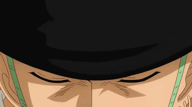 a close up of a person 's face with a hat on