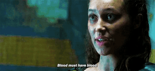 a close up of a woman 's face with the words blood must have blood .