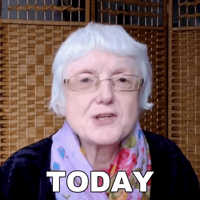 an elderly woman with glasses and a scarf says today