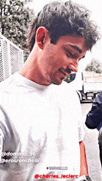 a man wearing a white t-shirt with the word maranello on it