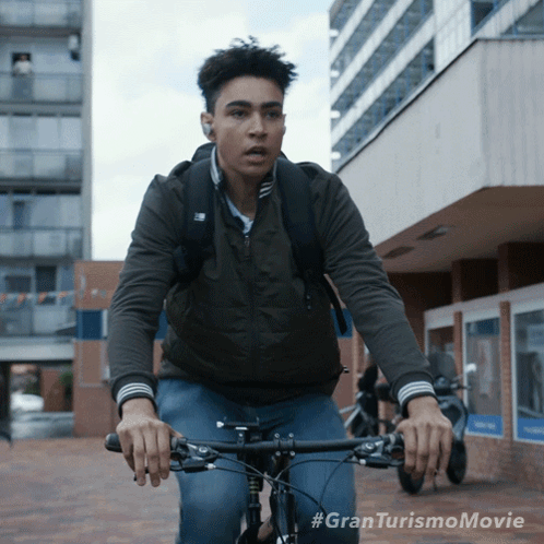 Riding A Bike Jann Mardenborough GIF - Riding A Bike Jann Mardenborough Archie Madekwe GIFs