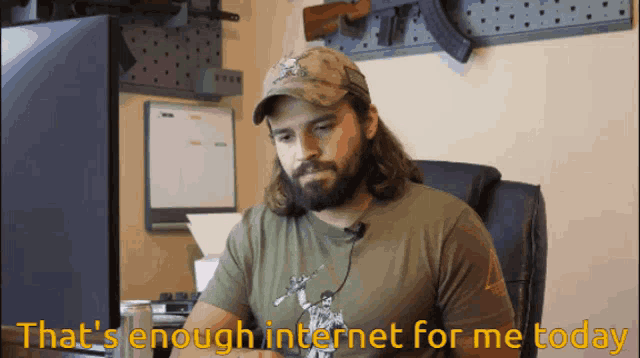 a man sitting in front of a computer with the words that 's enough internet for me today below him