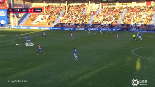 a soccer game is being played in a stadium sponsored by abanca