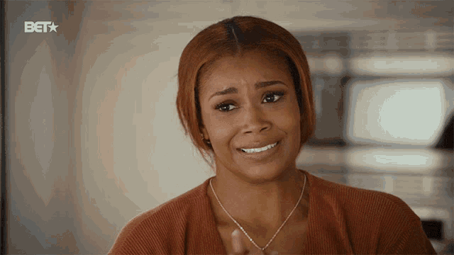 a woman is smiling in front of a bet star logo