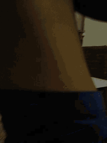 a close up of a person 's arm with a dark background